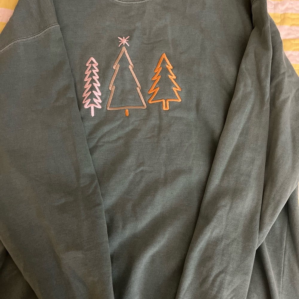 A CozySun ( Christmas trees) green sweater